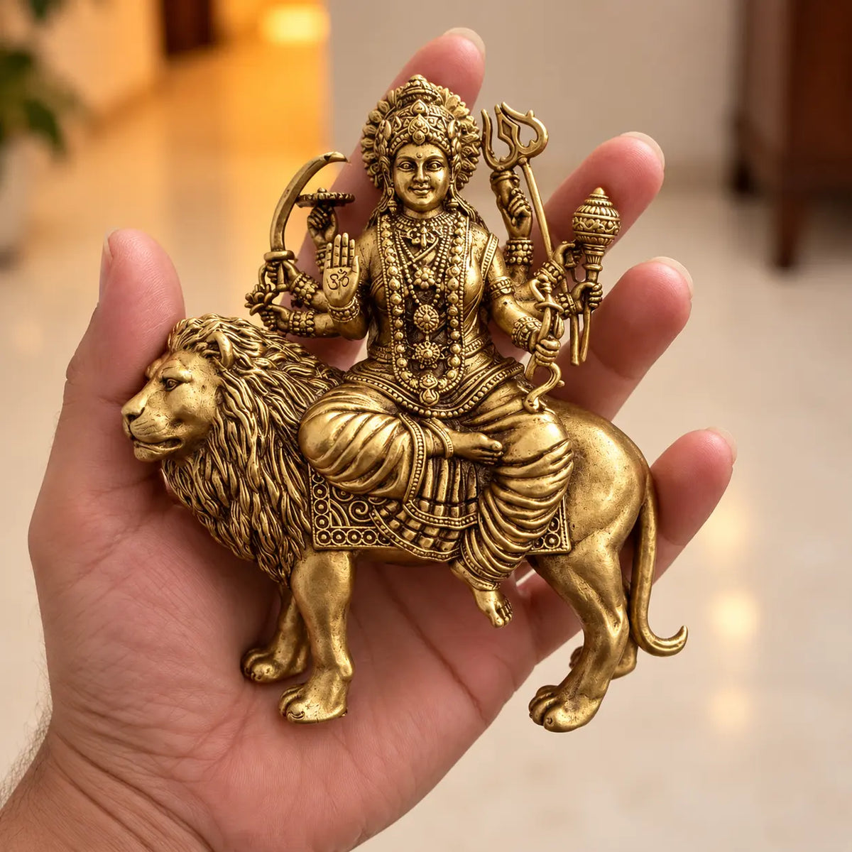 durga murti in hand brass